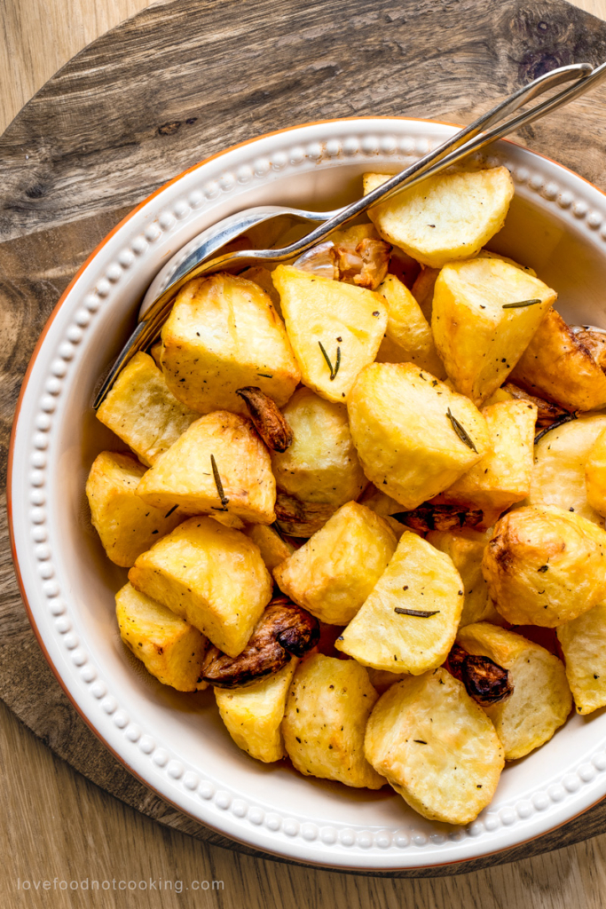 Air fried potatoes in a white serving bowl.
