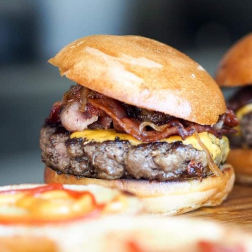 Air fryer hamburgers topped with cheese, bacon and mushrooms.