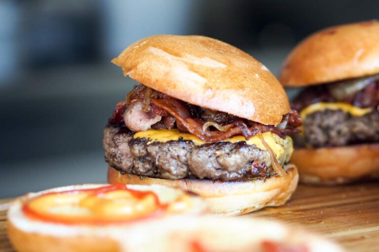 Air fryer hamburgers topped with cheese, bacon and mushrooms.