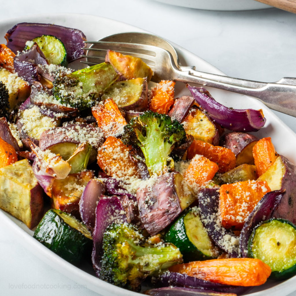 Air fryer roast vegetables in a white dish.