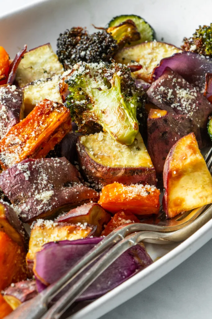 Air fryer roasted vegetables in a white serving dish.