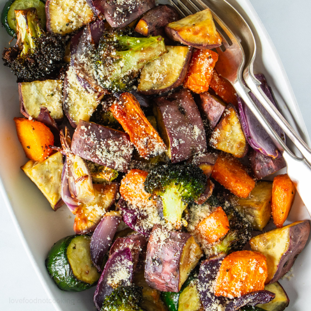 Flay lay photo of air fryer vegetables in a white serving dish. 