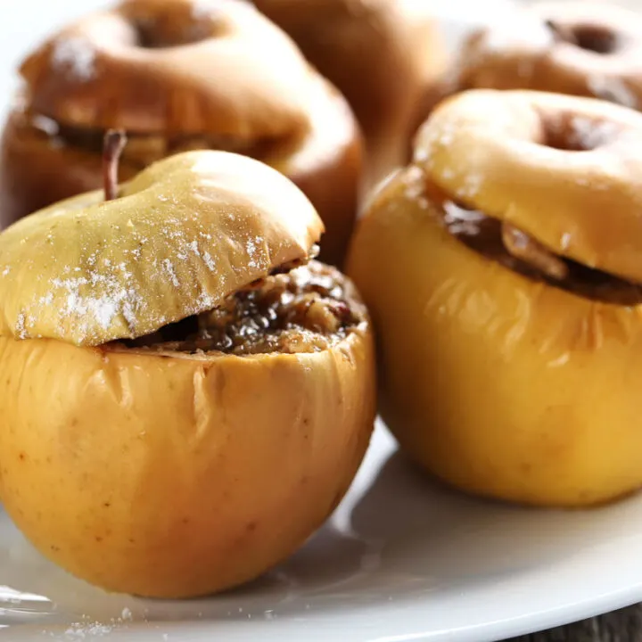Air fryer baked apples on a white plate.