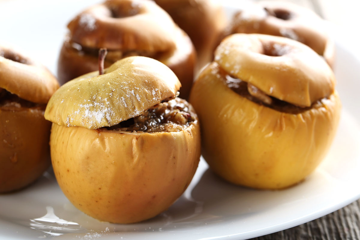 Air fryer baked apples on a white plate. 
