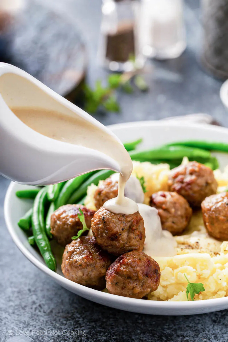 Air fryer meatballs with mashed potatoes and gravy. 
