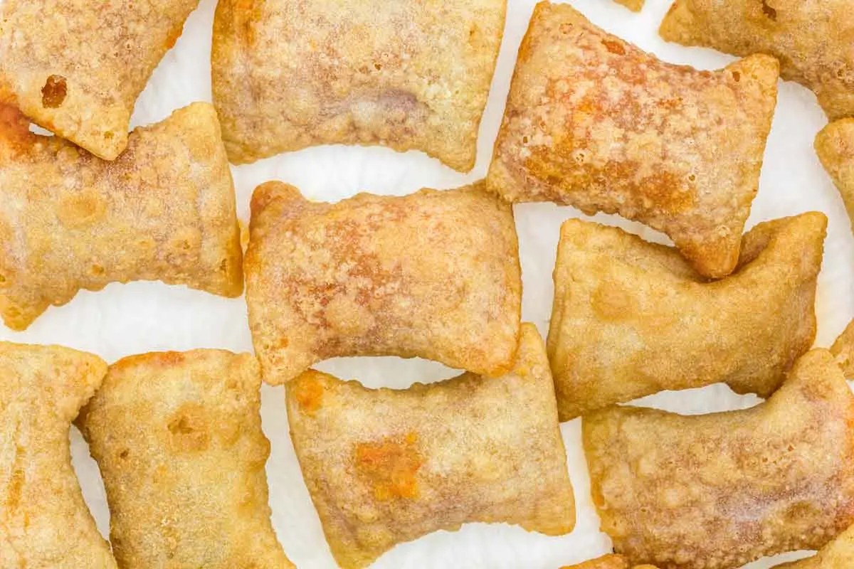 Air fried pizza rolls on a white background