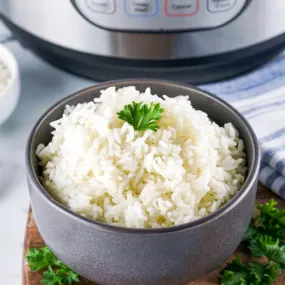 Instant Pot basmatic rice in a black bowl.