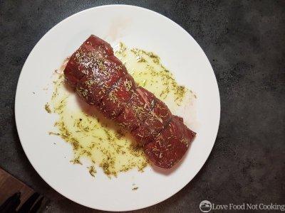 Seasoned air fryer beef tenderloin on a plate