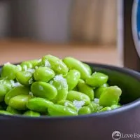 Microwave Steamed Edamame in a black bowl