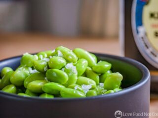 Microwave Steamed Edamame in a black bowl
