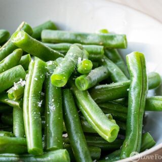 Microwaved fresh green beans in a bowl