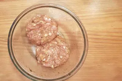 Shaped chicken patties in a bowl
