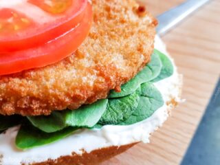 Air fryer frozen chicken patty on a bun with tomato and mayo