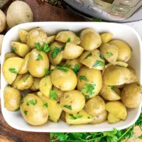 Instant Pot steamed potatoes in a white dish.