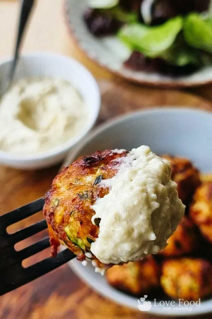 Chicken meatball dipped in hummus. 