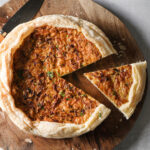Air fryer quiche on a wooden board.