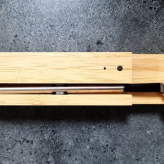 Meater thermometer in its storage block.