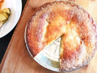 Air fried frozen apple pie with a slice cut.