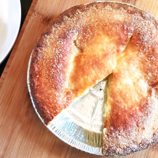 Air fried frozen apple pie with a slice cut.
