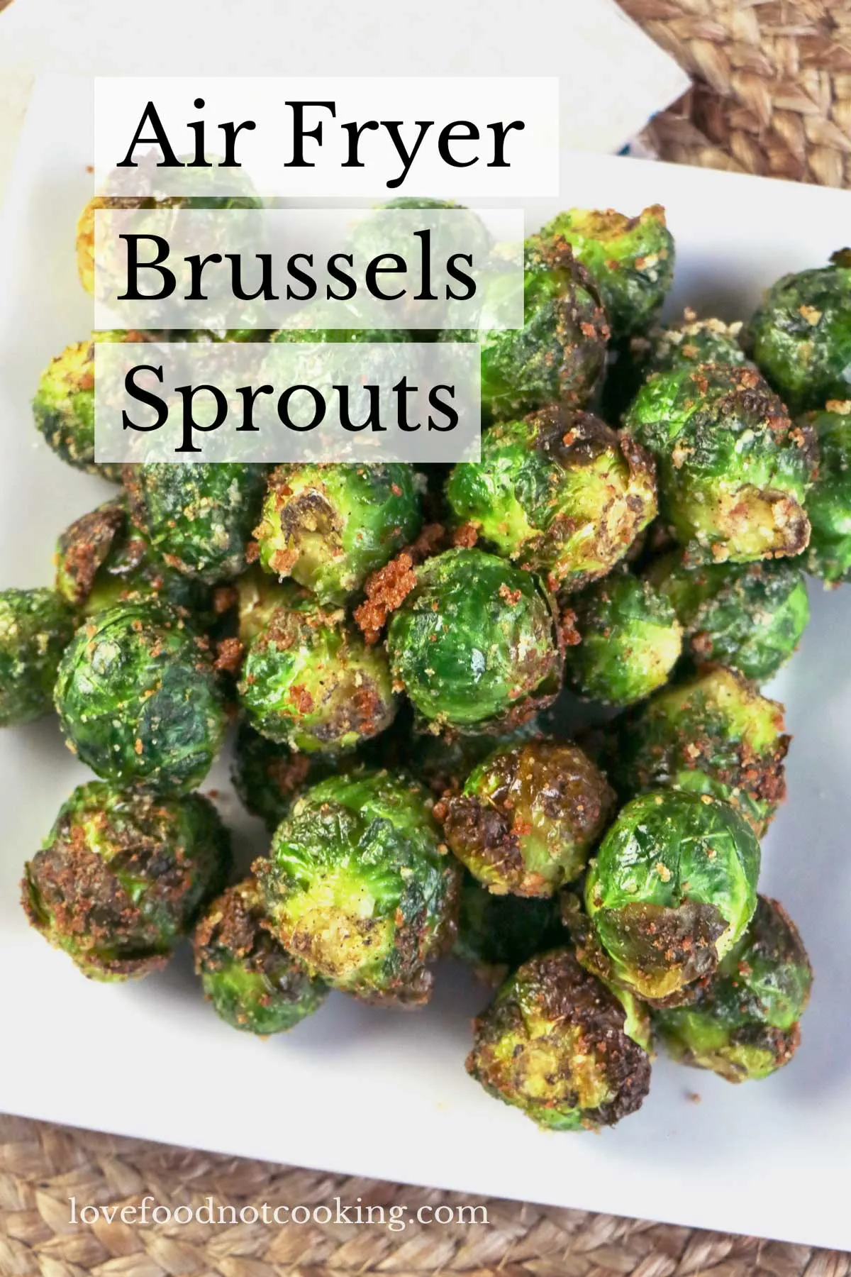 A white plate with air fried brussel sprouts. 