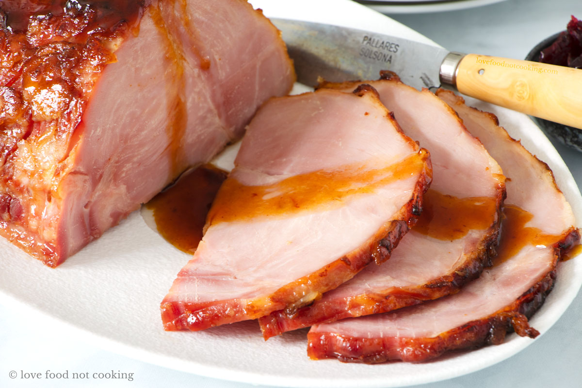 Air fried ham sliced on a white plate. 