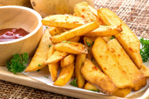 Air fryer steak fries with seasoning and bbq sauce.