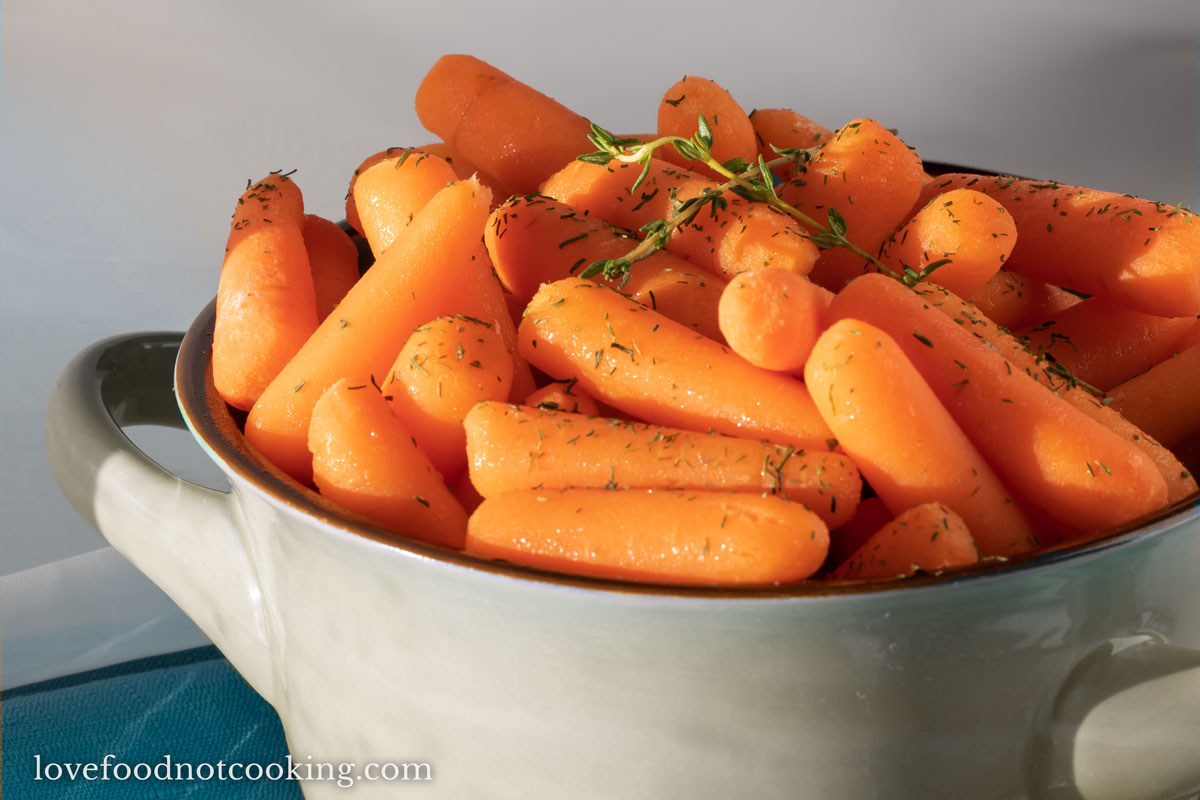 Instant pot steamed carrots in a grey bowl. 
