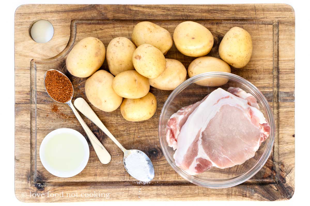 Flat lay image of the ingredients for this air fryer pork chops and potatoes recipe. 