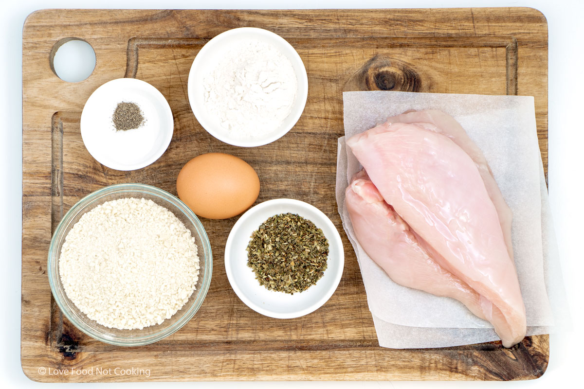 Flat lay of the ingredients for chicken cutlets. 