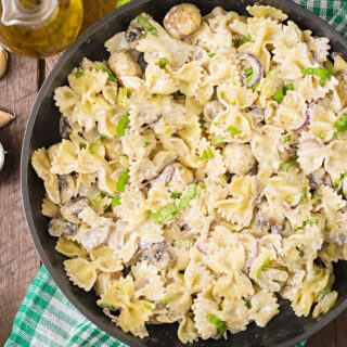Sour cream pasta sauce with farfalle pasta and mushrooms.