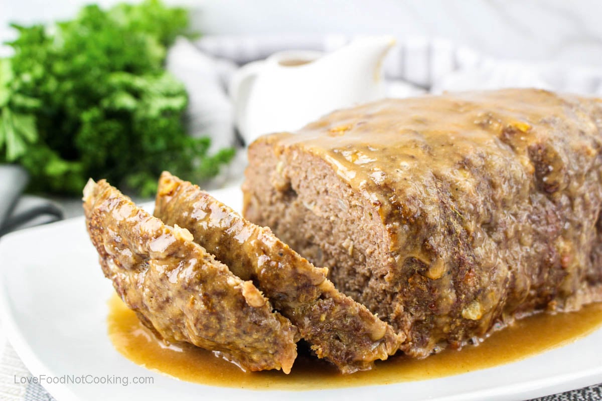 Air fryer meatloaf on a white plate.