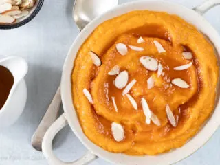 Instant Pot mashed sweet potatoes in a white bowl.