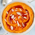 Instant Pot mashed sweet potatoes in a white bowl.