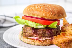 An air fryer turkey burger on a white plate.