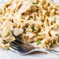 Instant Pot creamy chicken pasta on a white plate.