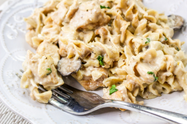 Instant Pot creamy chicken pasta on a white plate.