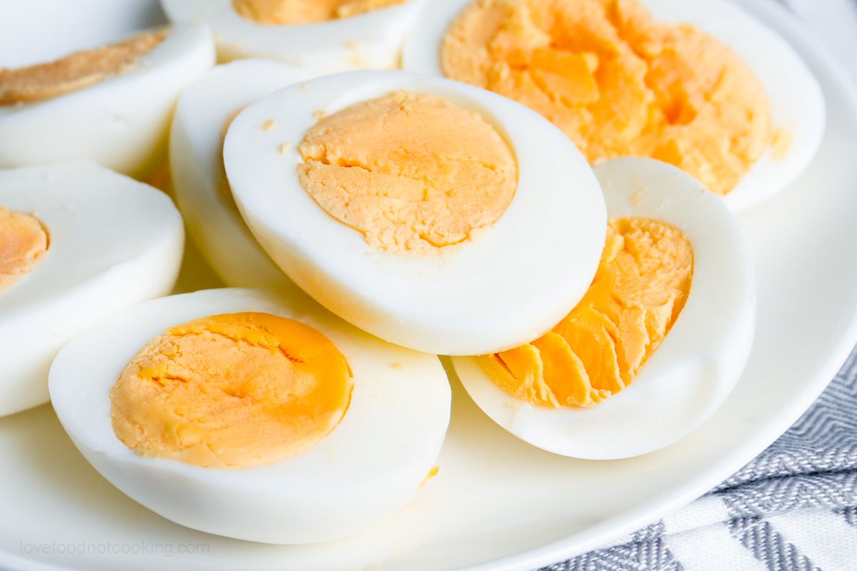 Air fryer boiled eggs on a white plate. 