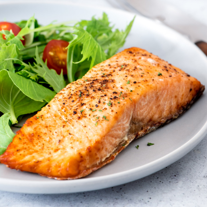 Air fryer salmon on a gray plate.