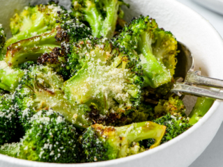 Air fryer broccoli in a white bowl.
