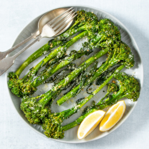 Air fryer broccolini on a white plate.