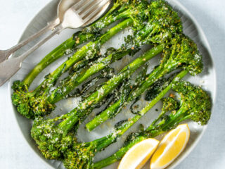Air fryer broccolini on a white plate.