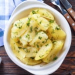 Microwave boiled potatoes in a white bowl.