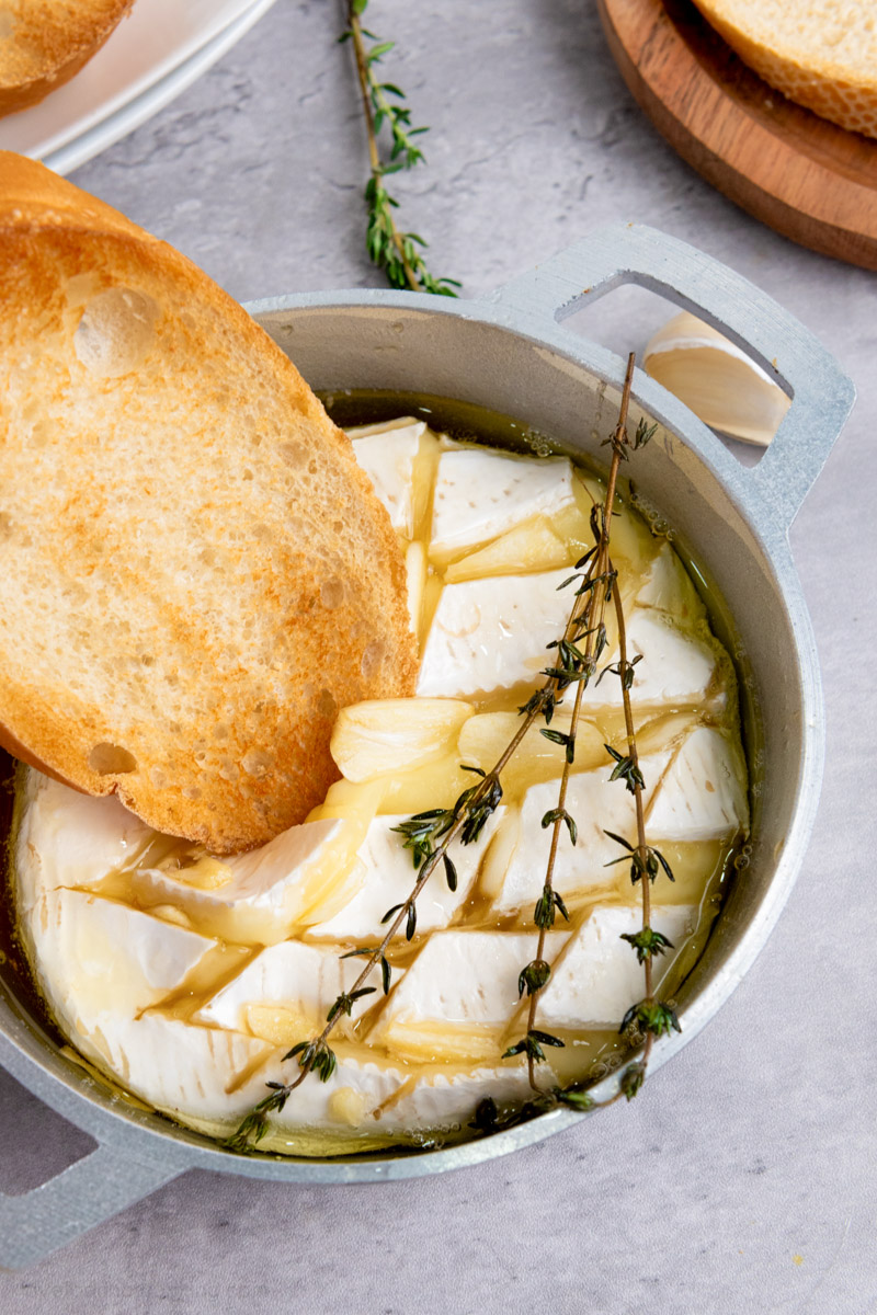 Air fryer baked camembert served with toasted baguette. 
