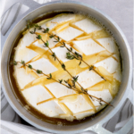 Air fryer camembert in a baking dish.