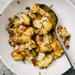 Air fryer cauliflower in a white bowl.