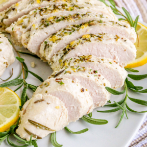 Instant Pot turkey tenderloin on a white plate.