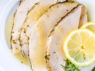 Instant Pot turkey breast on a white plate.