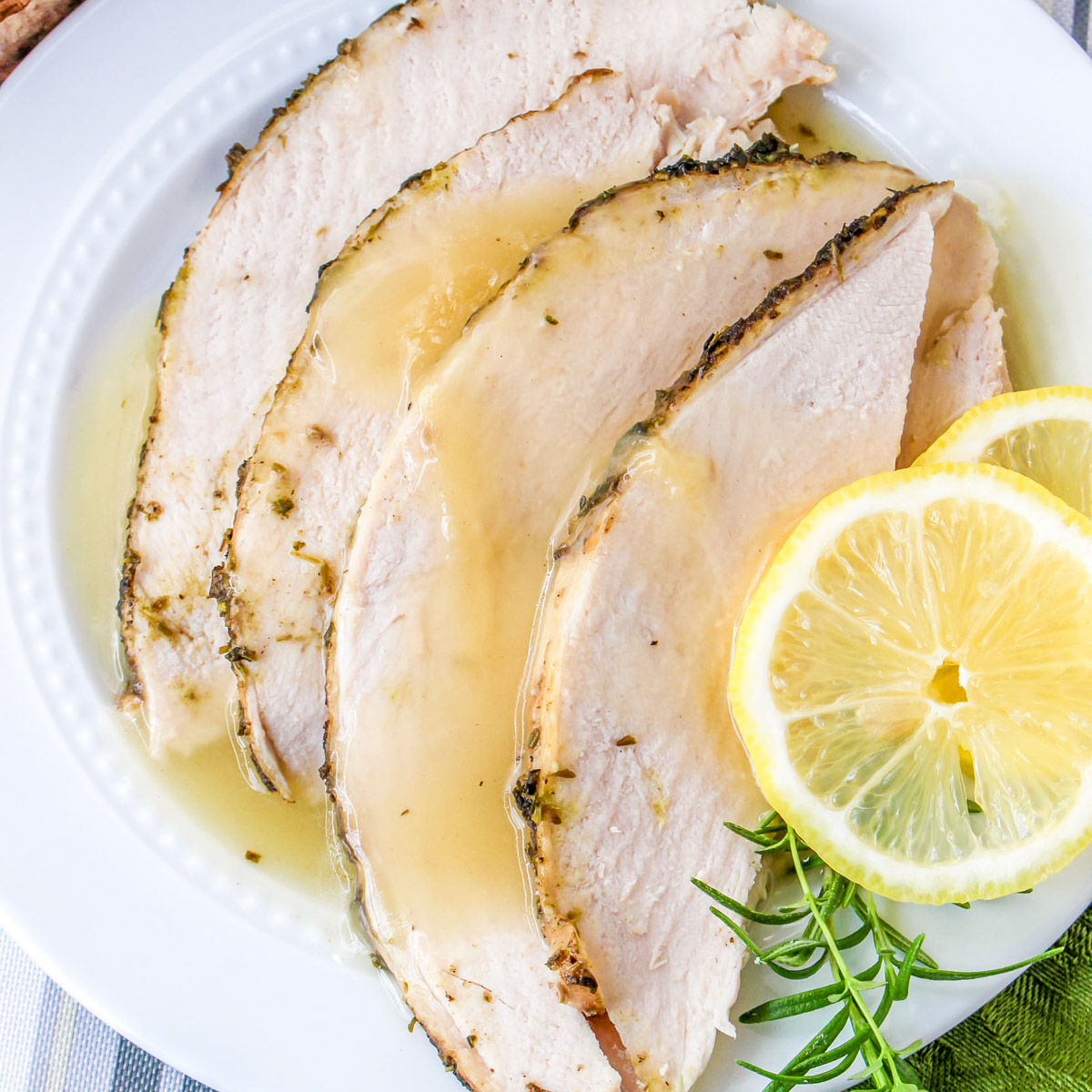 Instant Pot turkey breast on a white plate. 