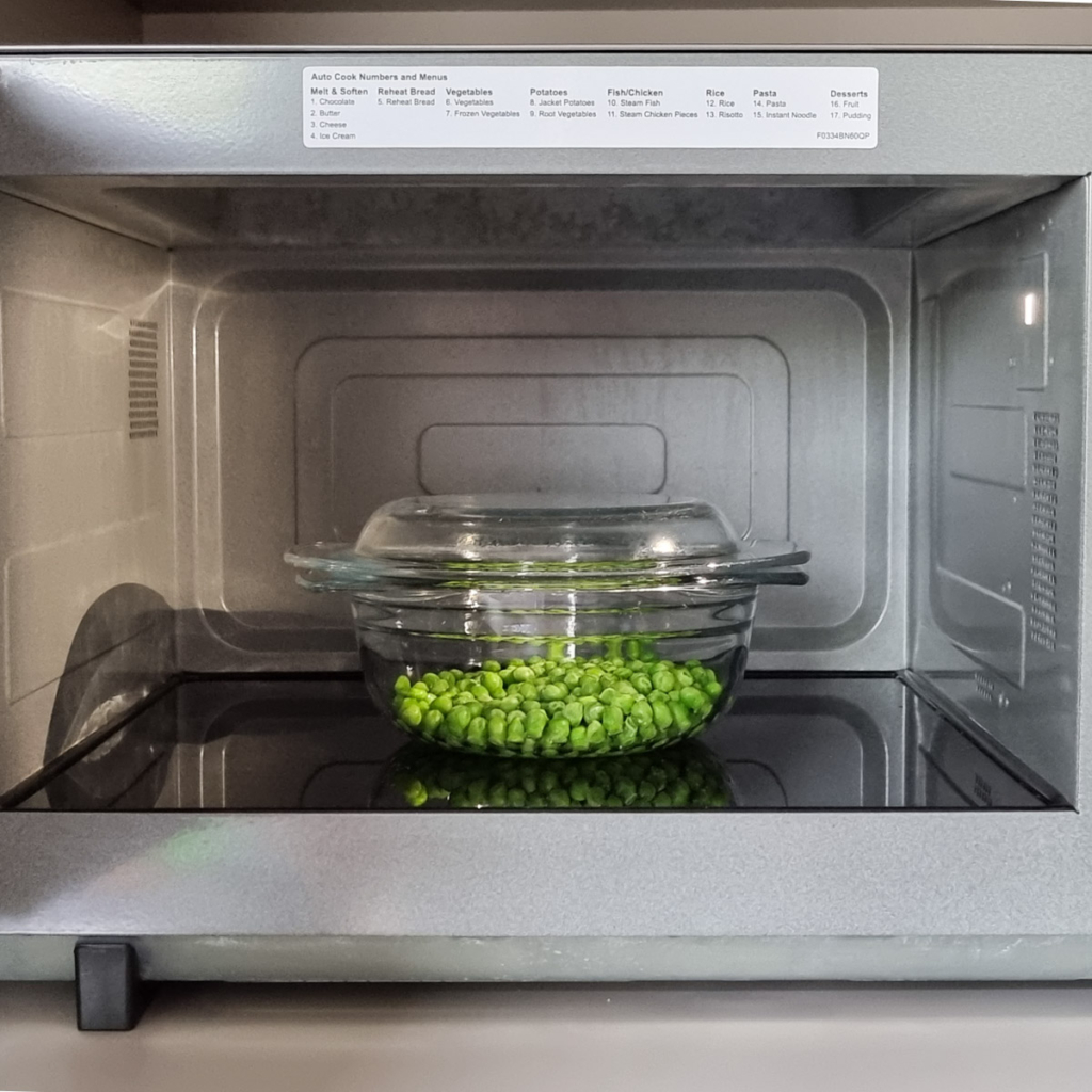 Frozen peas in microwave.