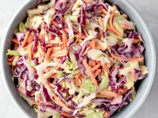 Classic creamy coleslaw in a grey bowl.